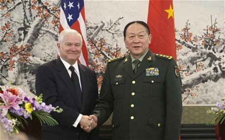 USA & Chinese Defense ministers shake hands, attempt smiles