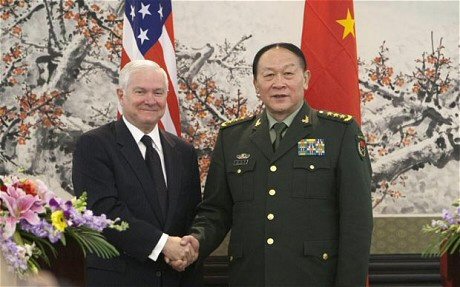 USA & Chinese Defense ministers shake hands, attempt smiles